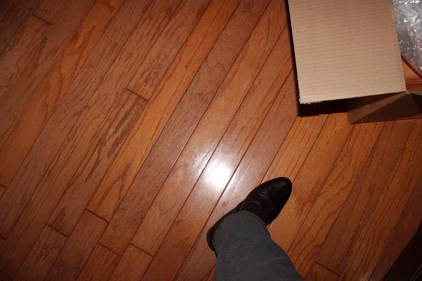 Clearing the Dining Room Table in Five Minutes #5MinuteFriday trying on boot from ThredUp at ASlobComesClean.com